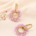 Pendientes de cristal y acero, anillos entrelazados